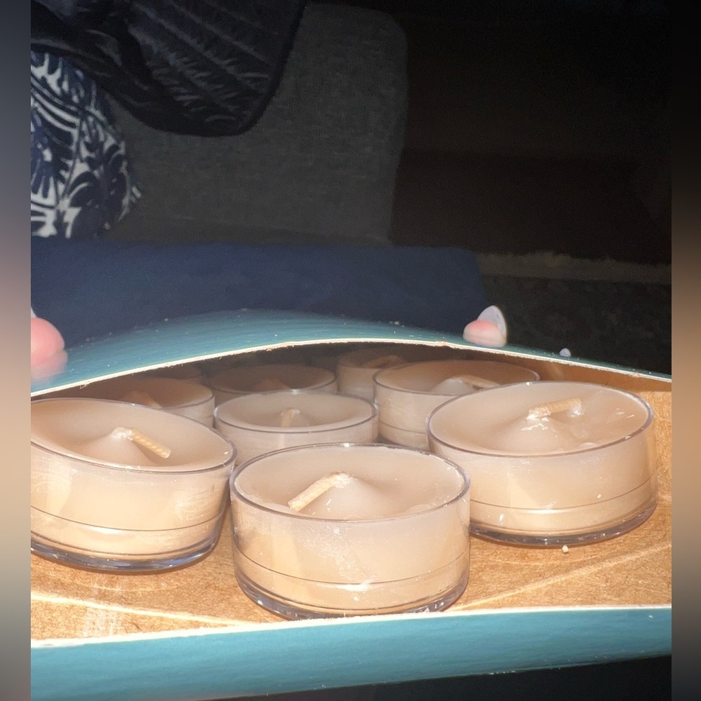 NIB! Discontinued! PartyLite set of 12 tealight candles in scent Ambiance.